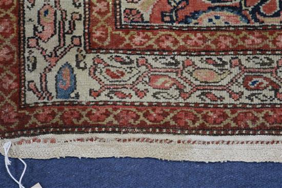 A Serabend rug with all-over boteh design in red, pink, blue and ivory, 195cm x 125cm